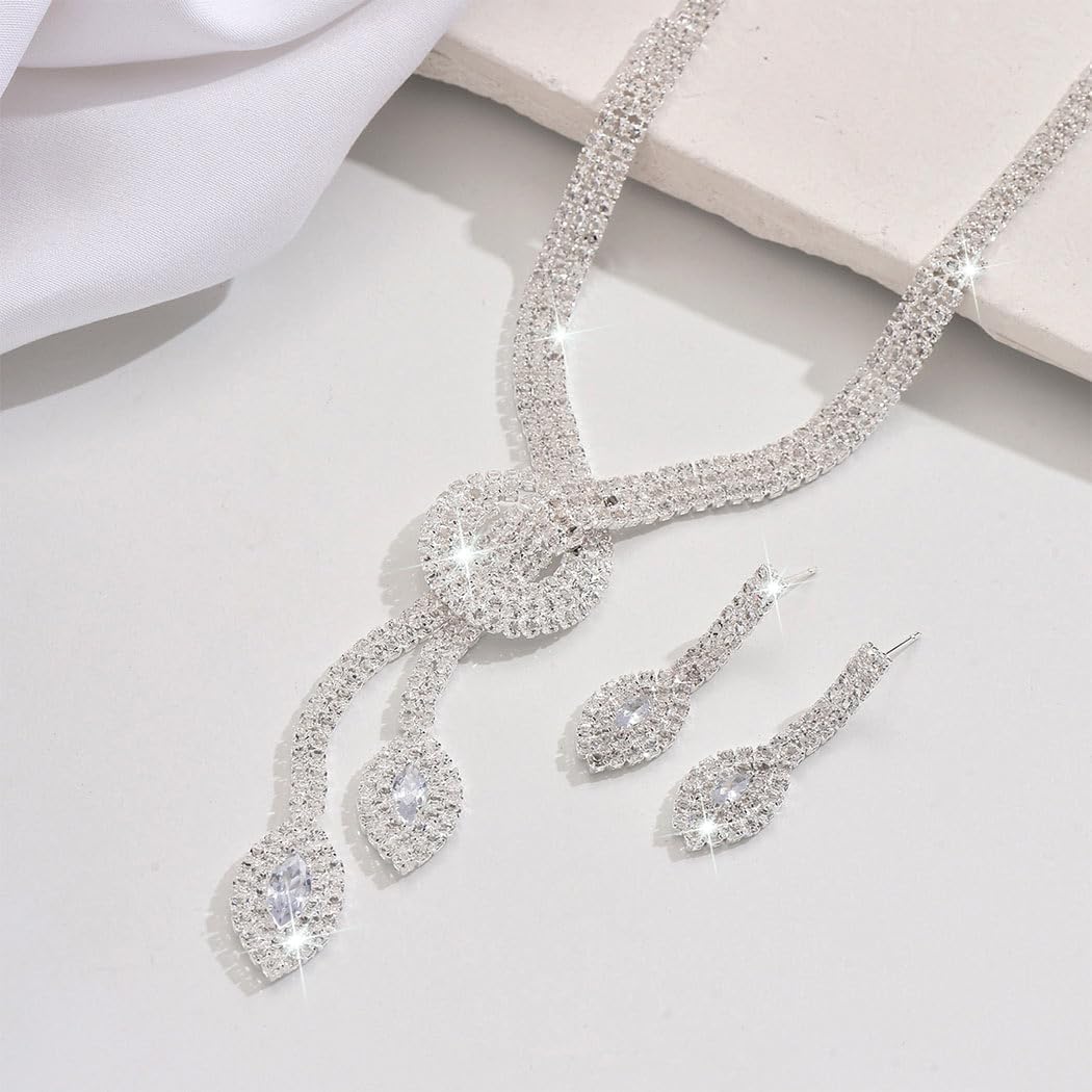 61Ulr8fBmYL._AC_SL1500_ كاستويف طقم مجوهرات مرصع باحجار الراين، طقم عقد واقراط وسوار من الكريستال الفضي اللامع، اكسسوارات مجوهرات للحفلات الراقصة، اكسسوارات الزفاف للعروس، مجموعات مجوهرات رسمية للنساء - الصورة 3